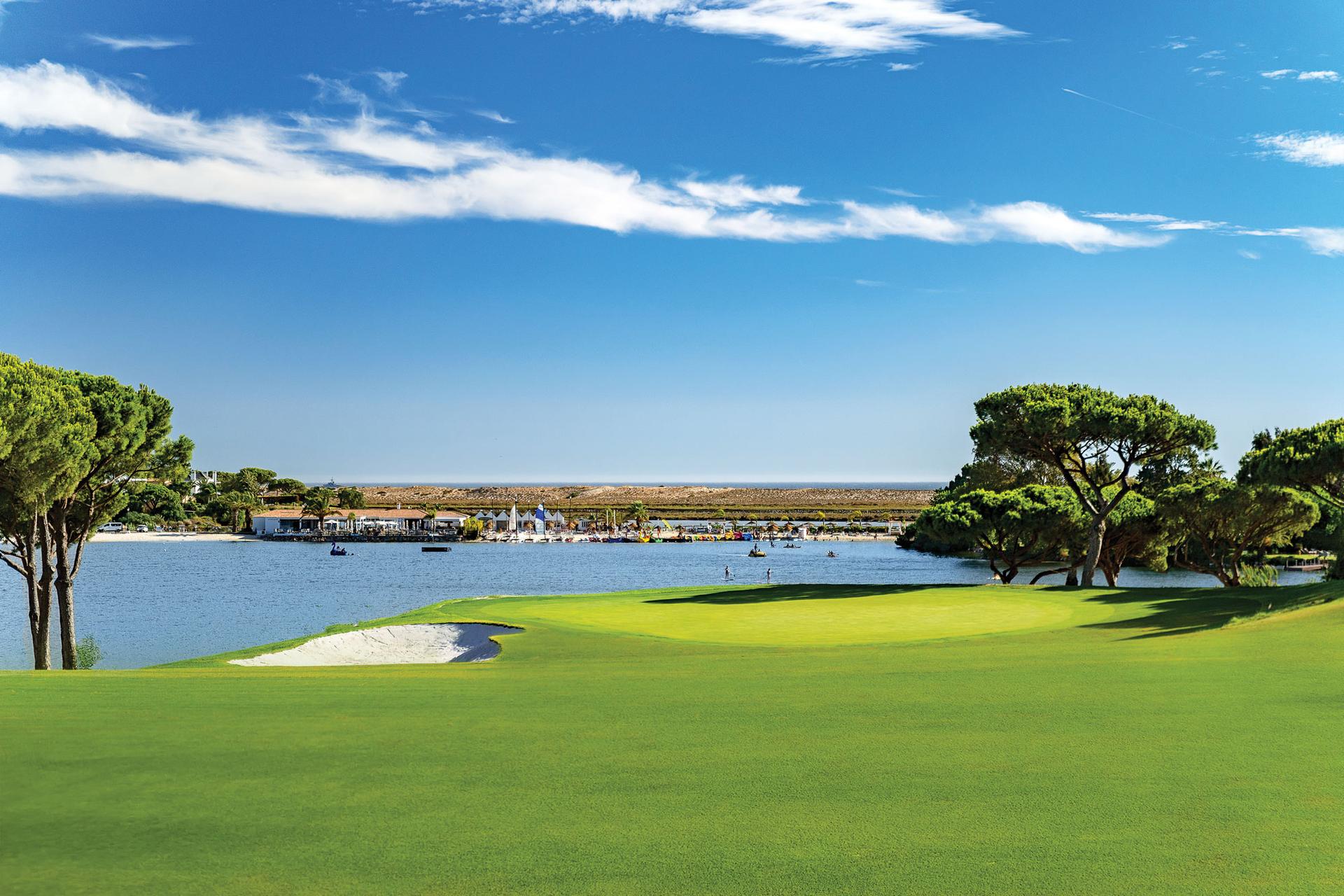 Green with a water hazard behind
