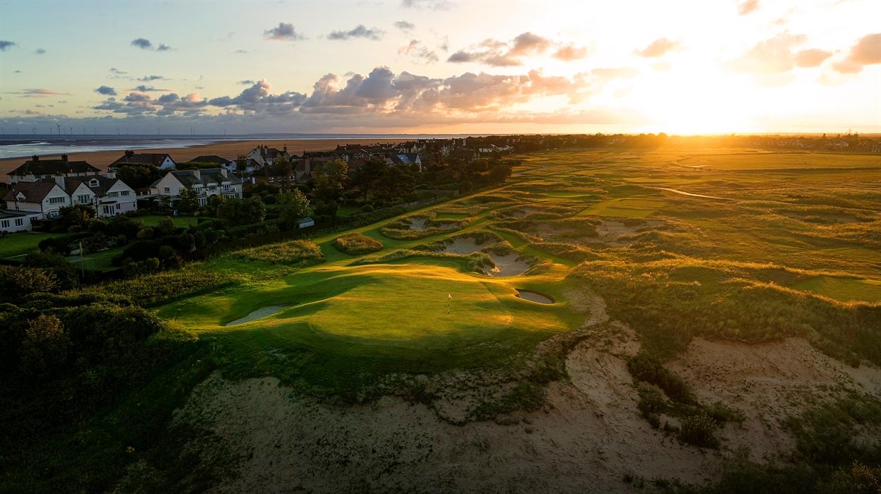 Sun setting over the Royal Liverpool course which neighbours the local town