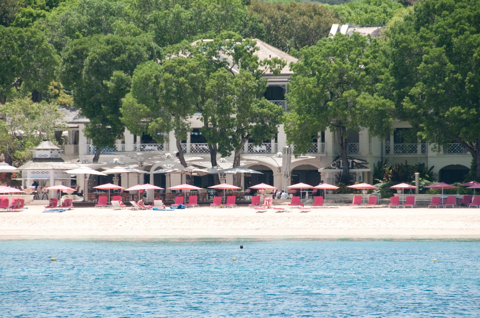 The Sandy Lanes resort building showing through its surrounding trees