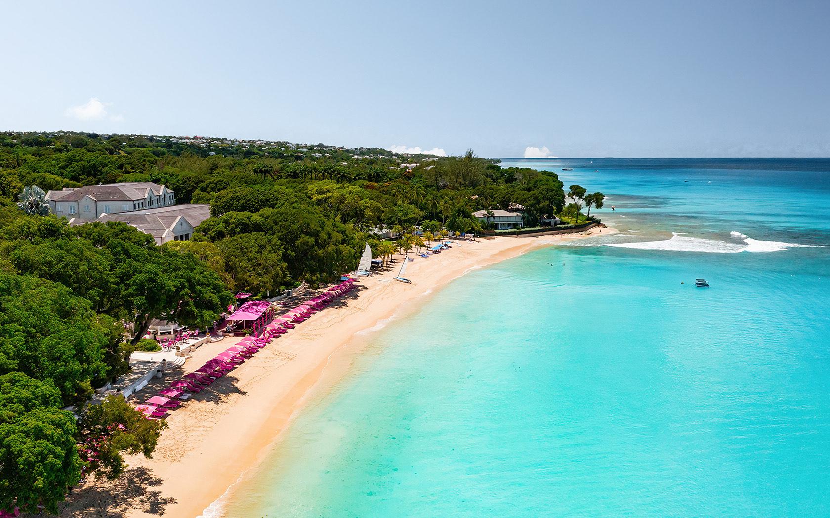 Aariel view of Sandy Lanes beach nestled with pink sun beds