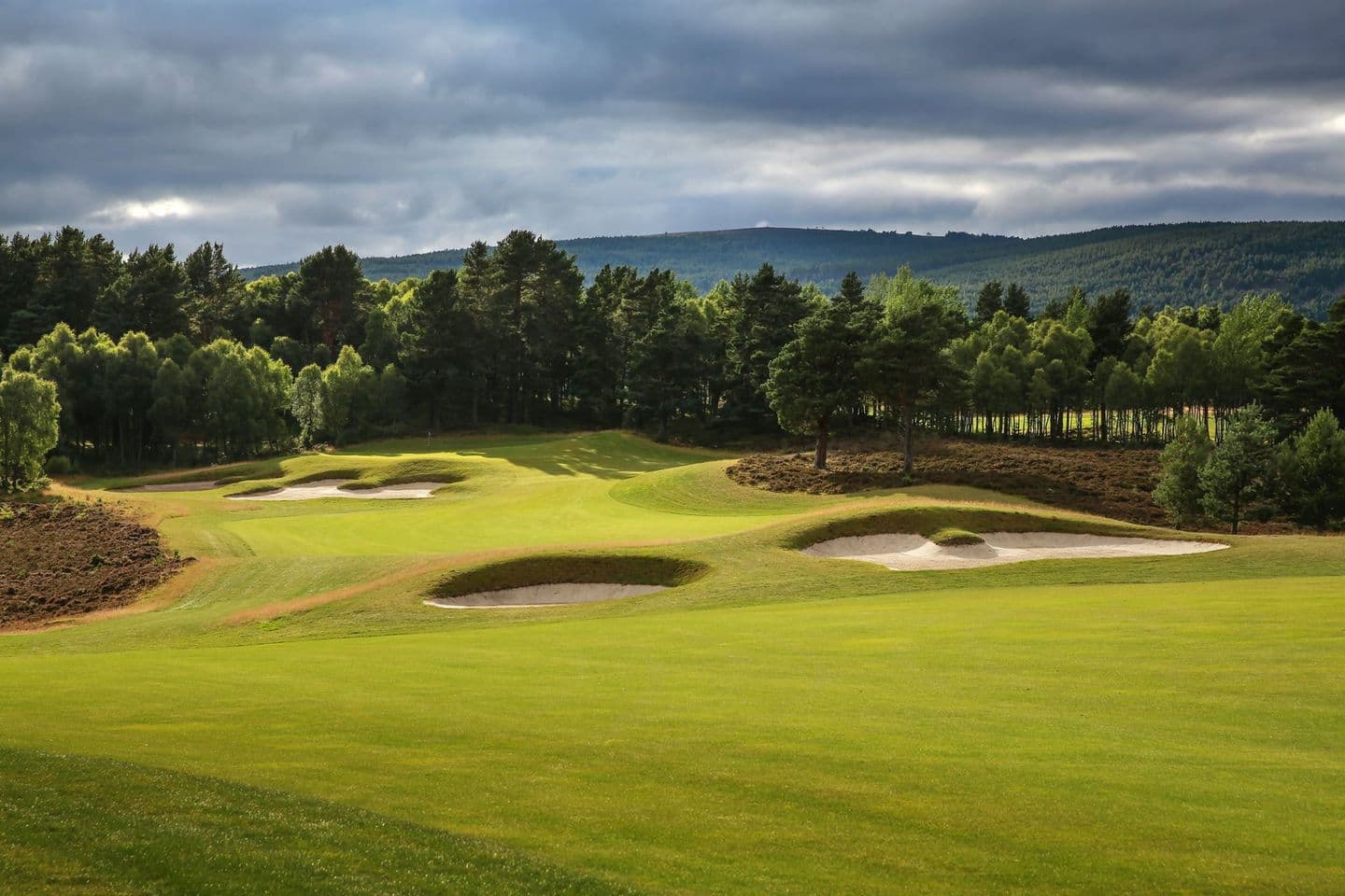Well-maintained greens with deep sand bunkers and vibranyt trees giving the course life