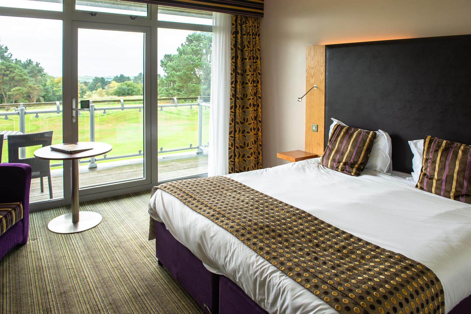 Double bed suite with patio views of the course