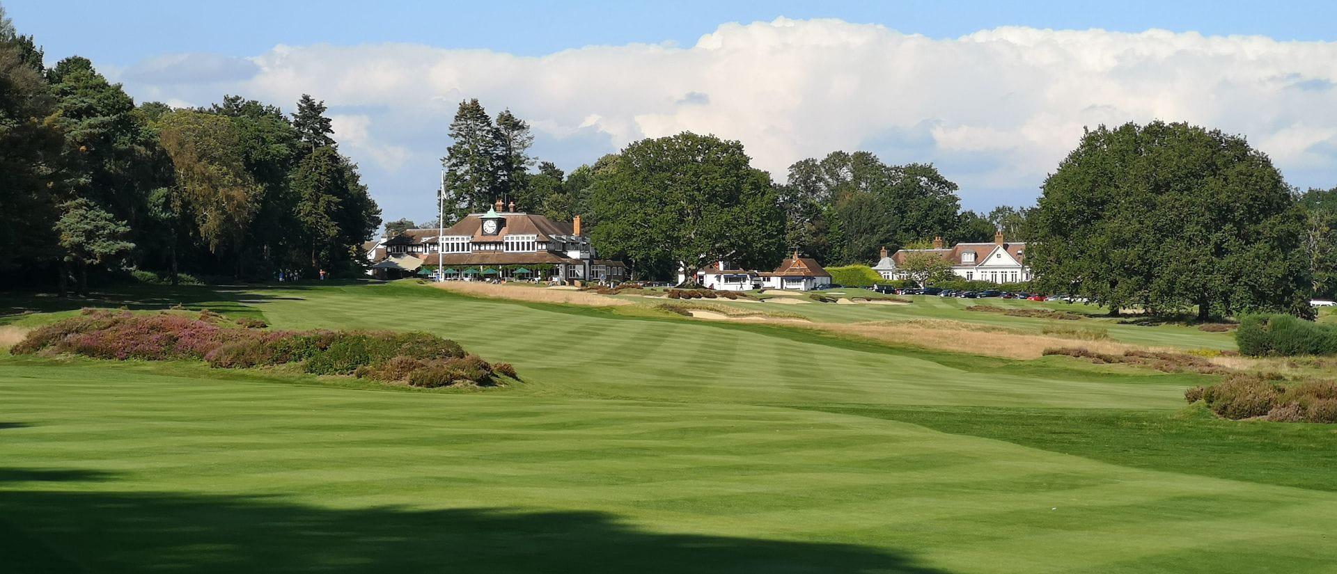 A sweeping fairway leads toward the clubhouse in the distance