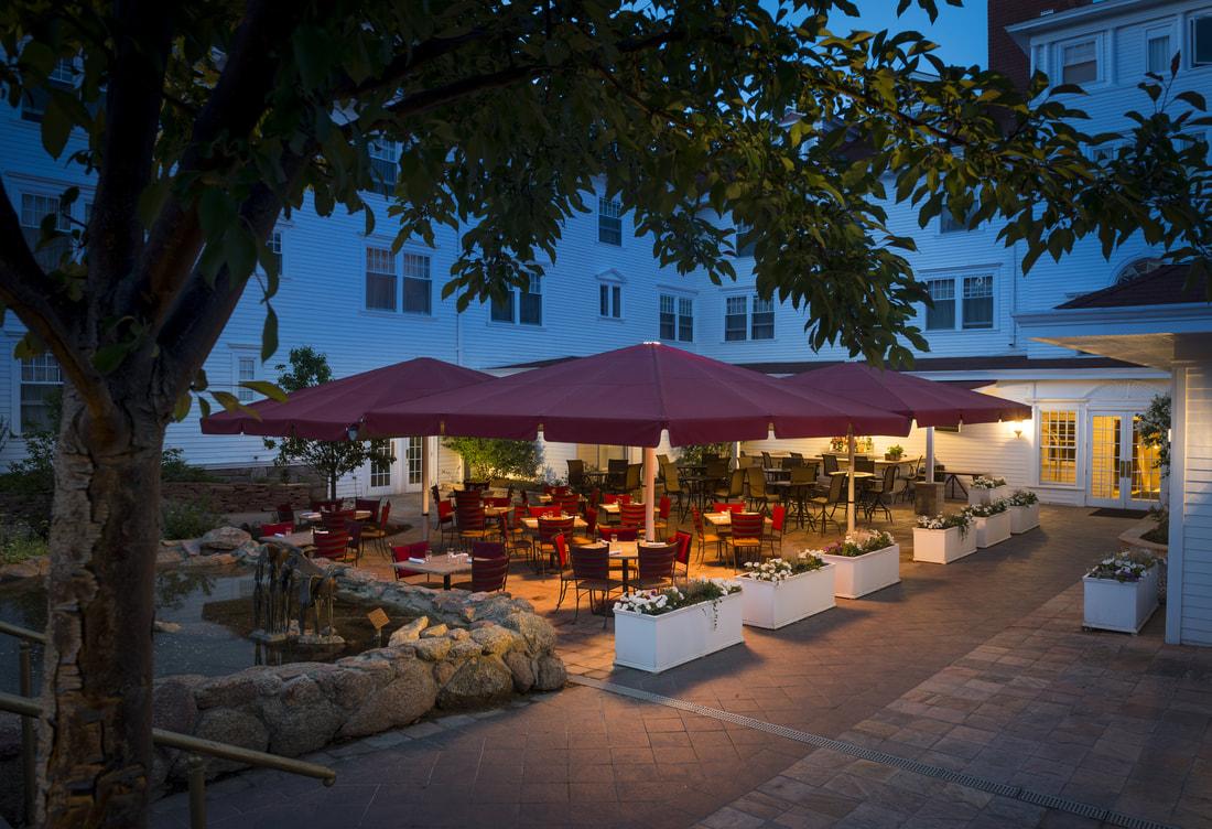 Outdoor seating area with red umbrellas