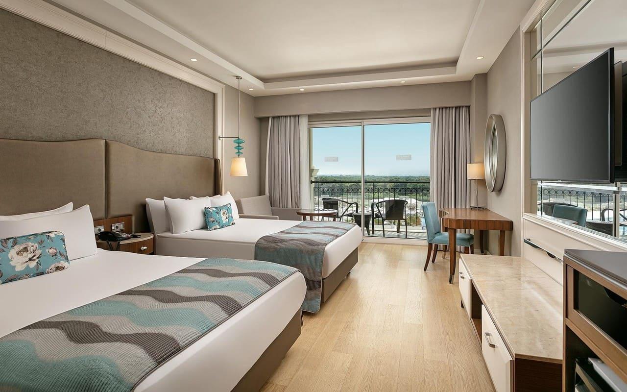 Two double beds with a balcony in a Twin / Double Room