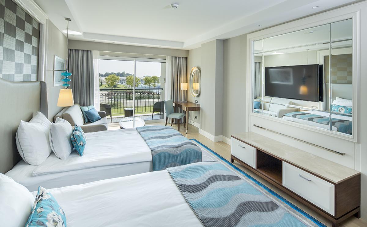 Two twin beds with a balcony in a Double / Twin Room