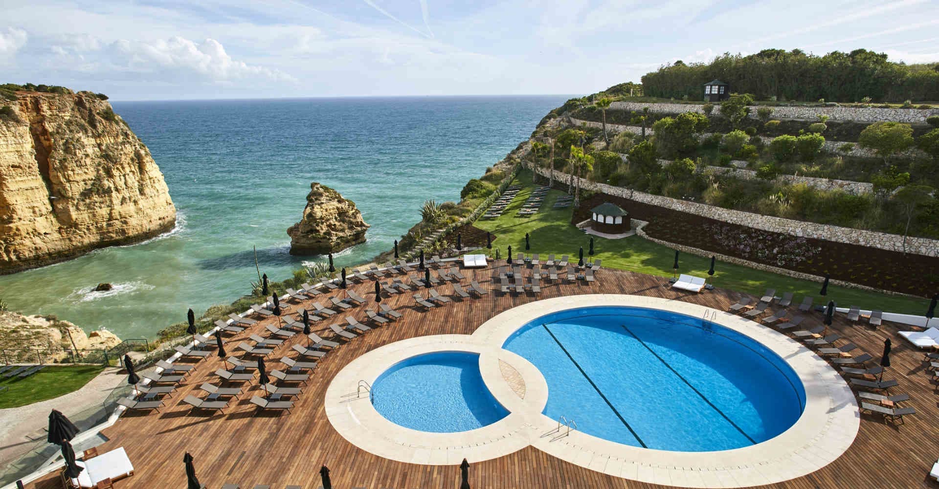 Outdoor swimming pool area overlooking the ocean