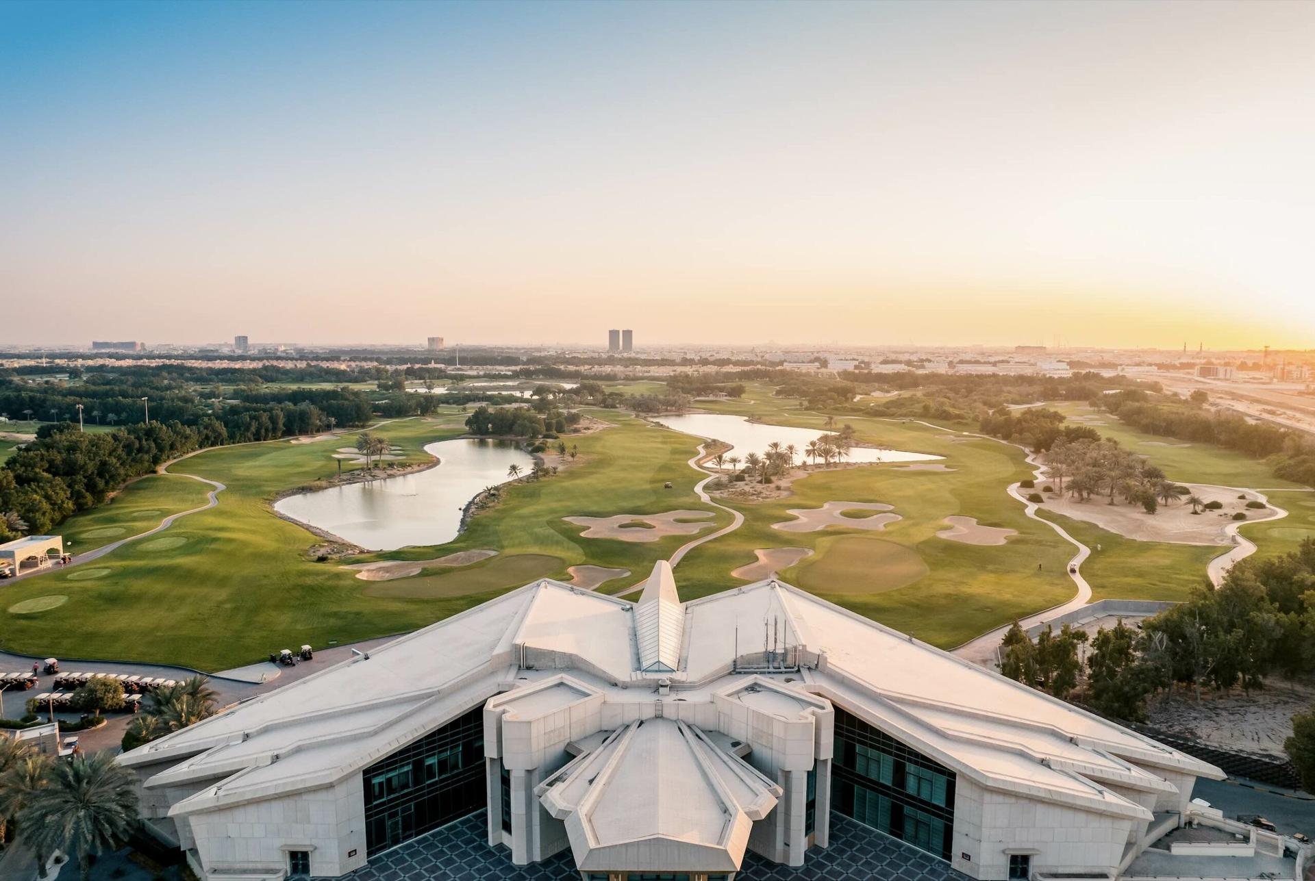 Overhead view of the VOGO Abu Dhabi Golf Resort & Spa clubhouse overlooking the golf course
