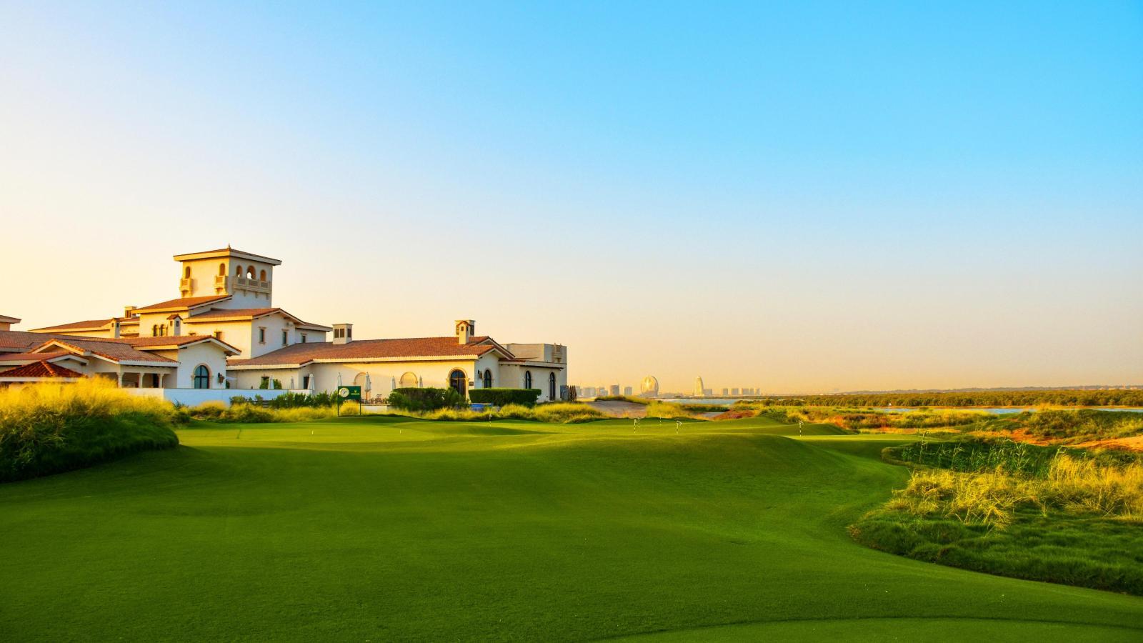 Rooftop terrace overlooking Yas Links and the city