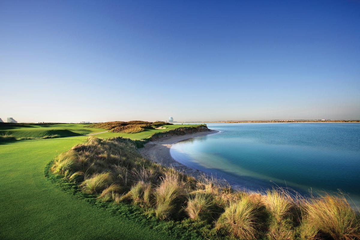 A wide fairway leading to a smooth green running along the coast