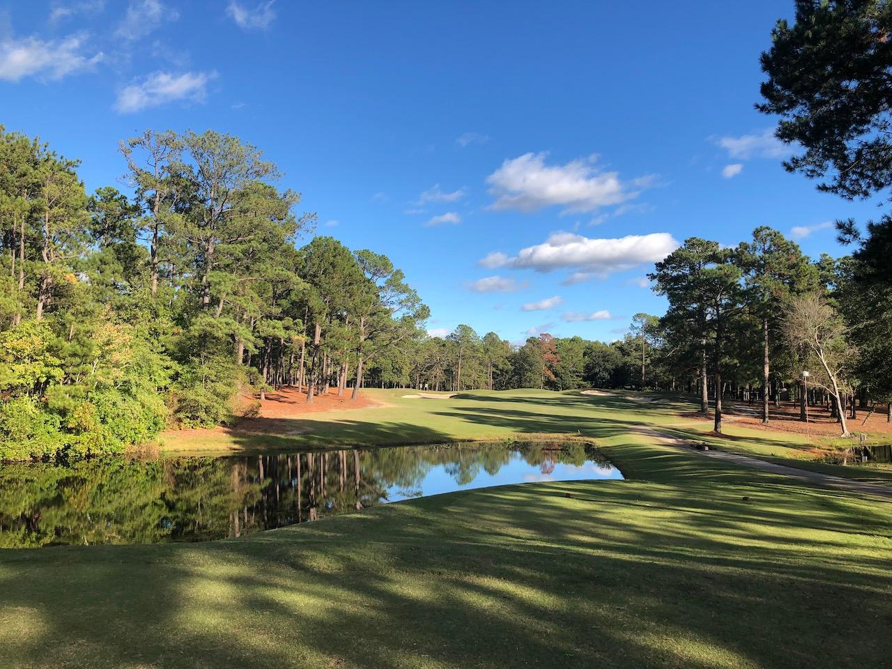 Columbia Country Club Par 4 with a tee shot over water