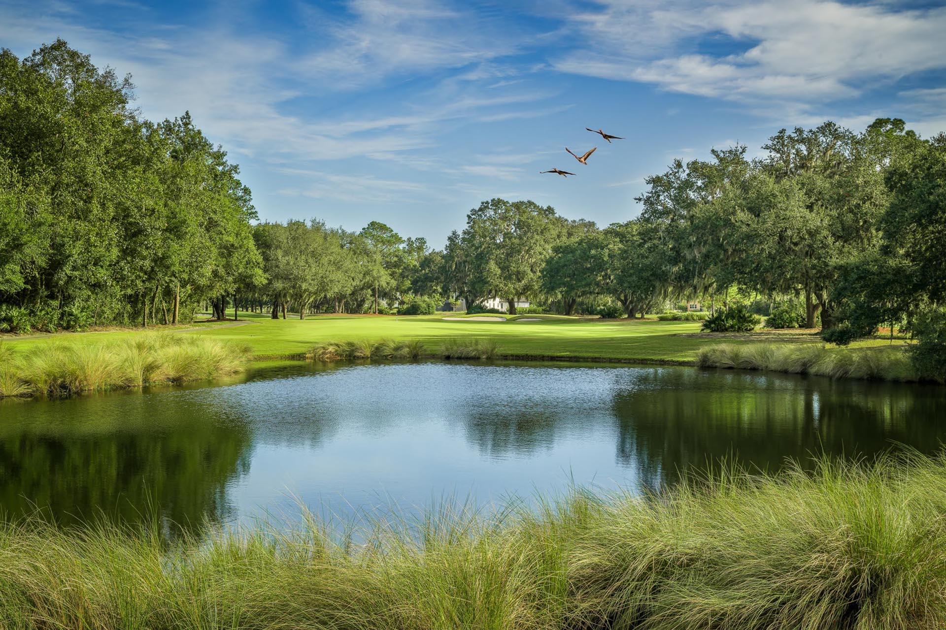 A large water hazard on the course at Grande Villas at World Golf Village