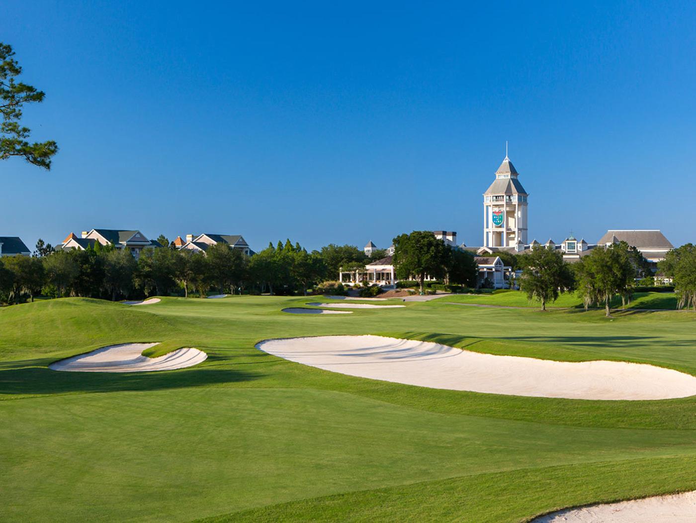 Panoramic view of the world golf resort building towering over the course