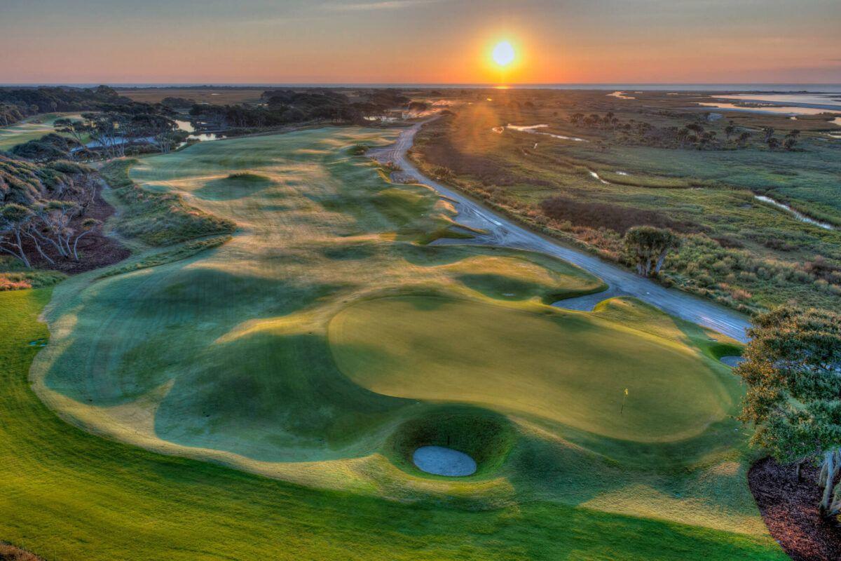 Narrow, undulating fairway at sunset