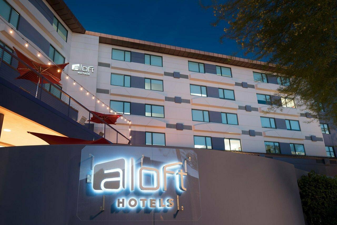 The Aloft sign lit up by LED lights