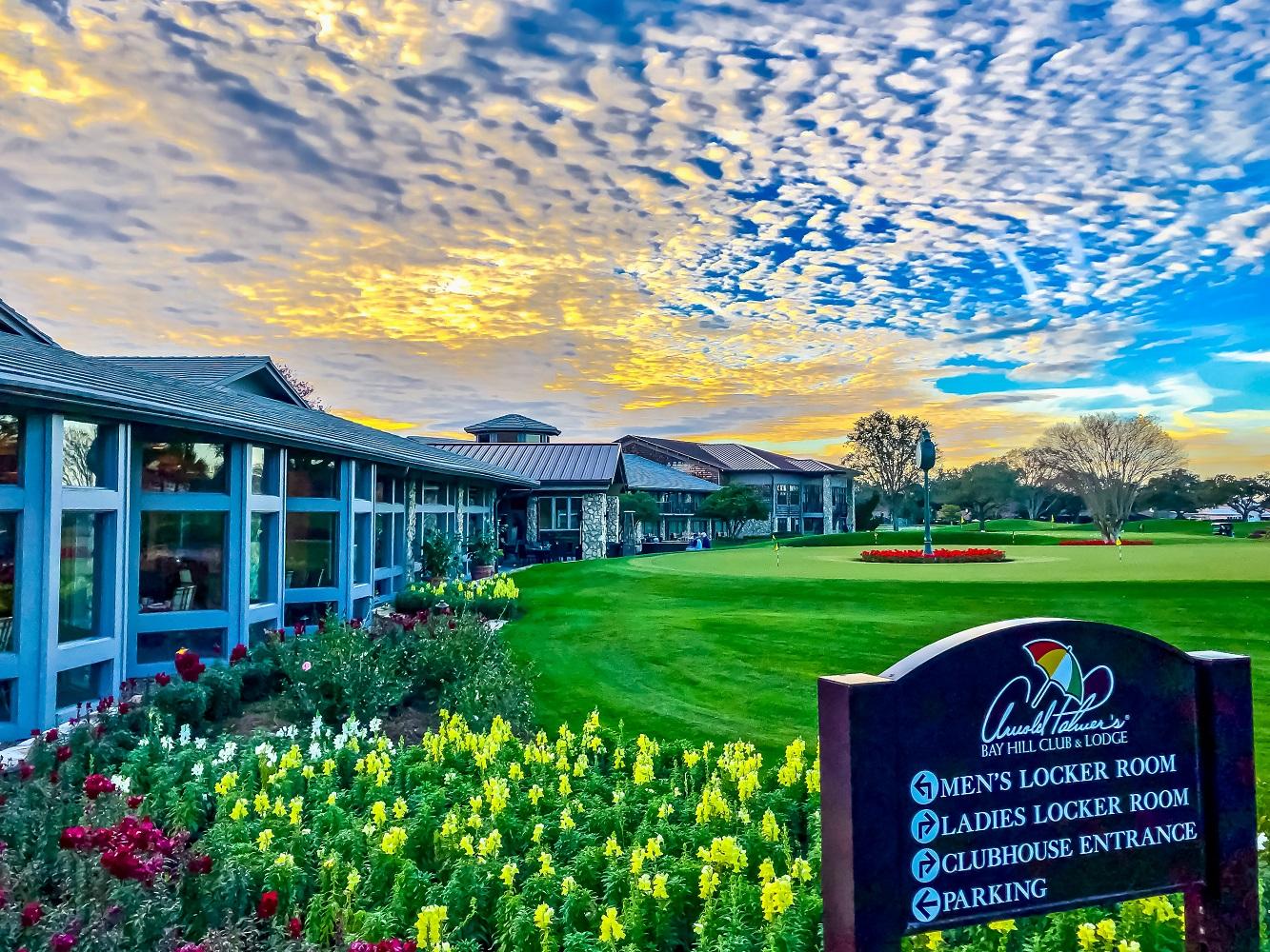 View of the exterior of the clubhouse and the putting green