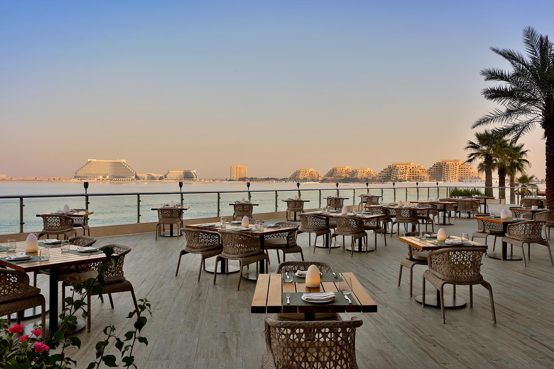 Outdoor dining area with sea views