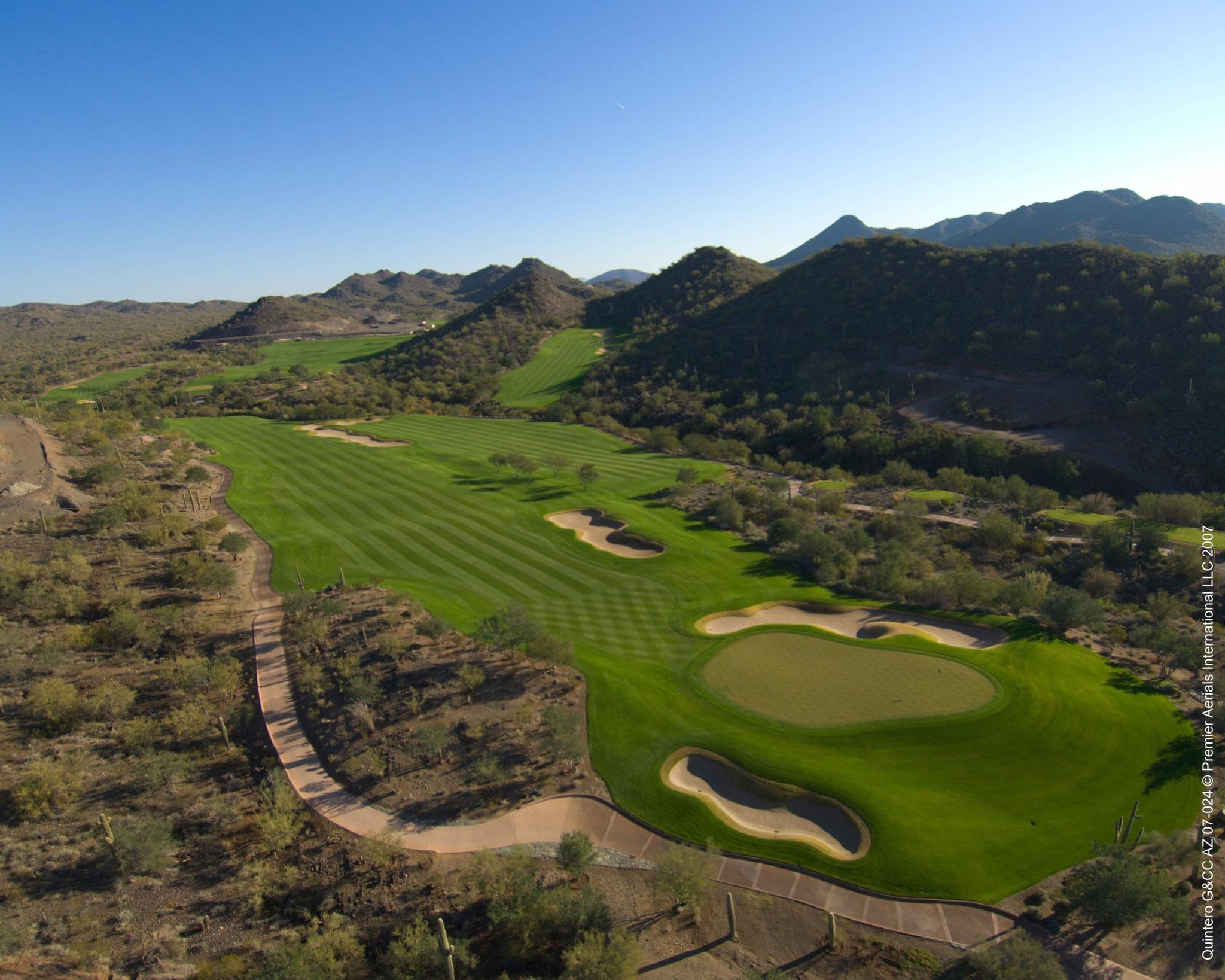 Birdseye view of a well maintained fairway leading to a smooth green
