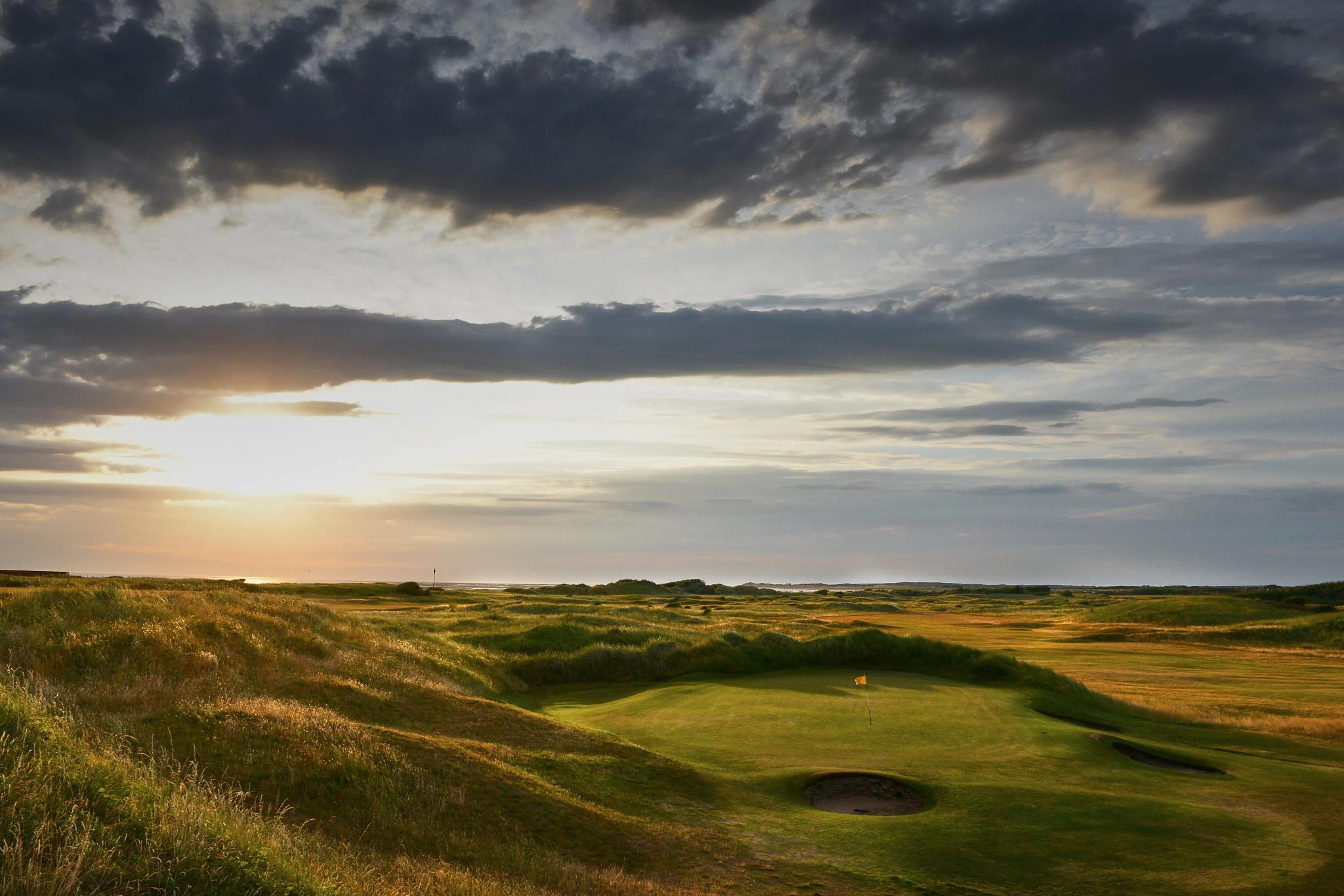 Sun setting over the course