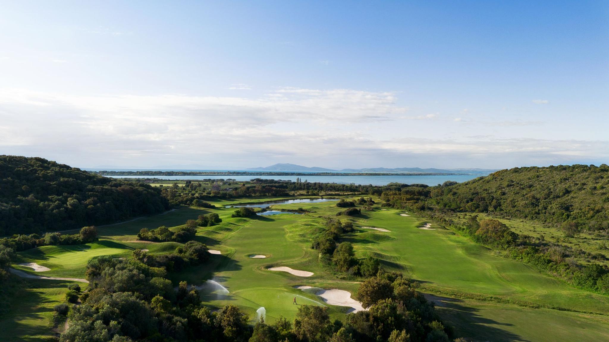 Overhead view of well maintained fairway nestled with sand bunkers