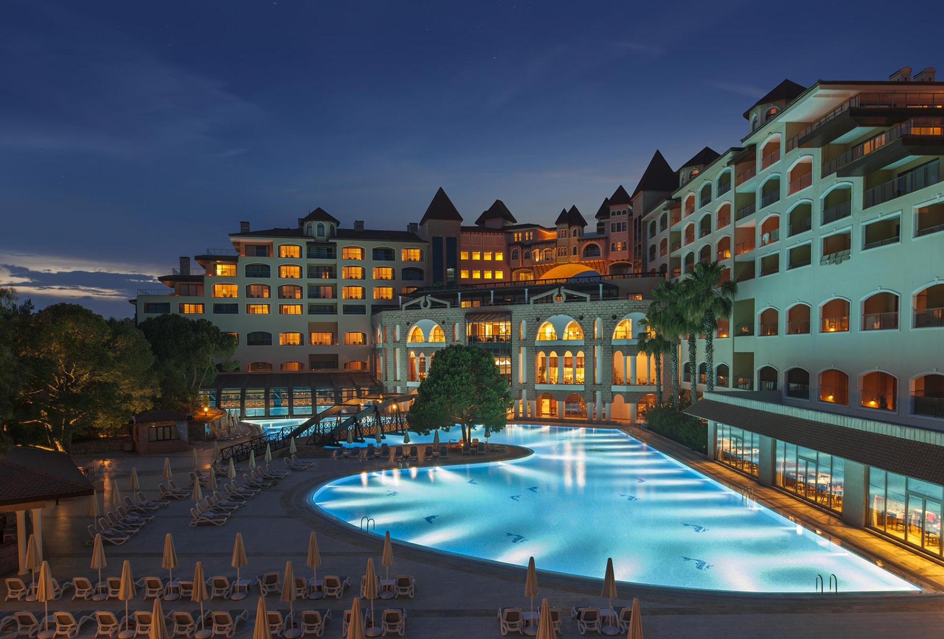 Exterior view of the Sirene Belek Hotel at evening