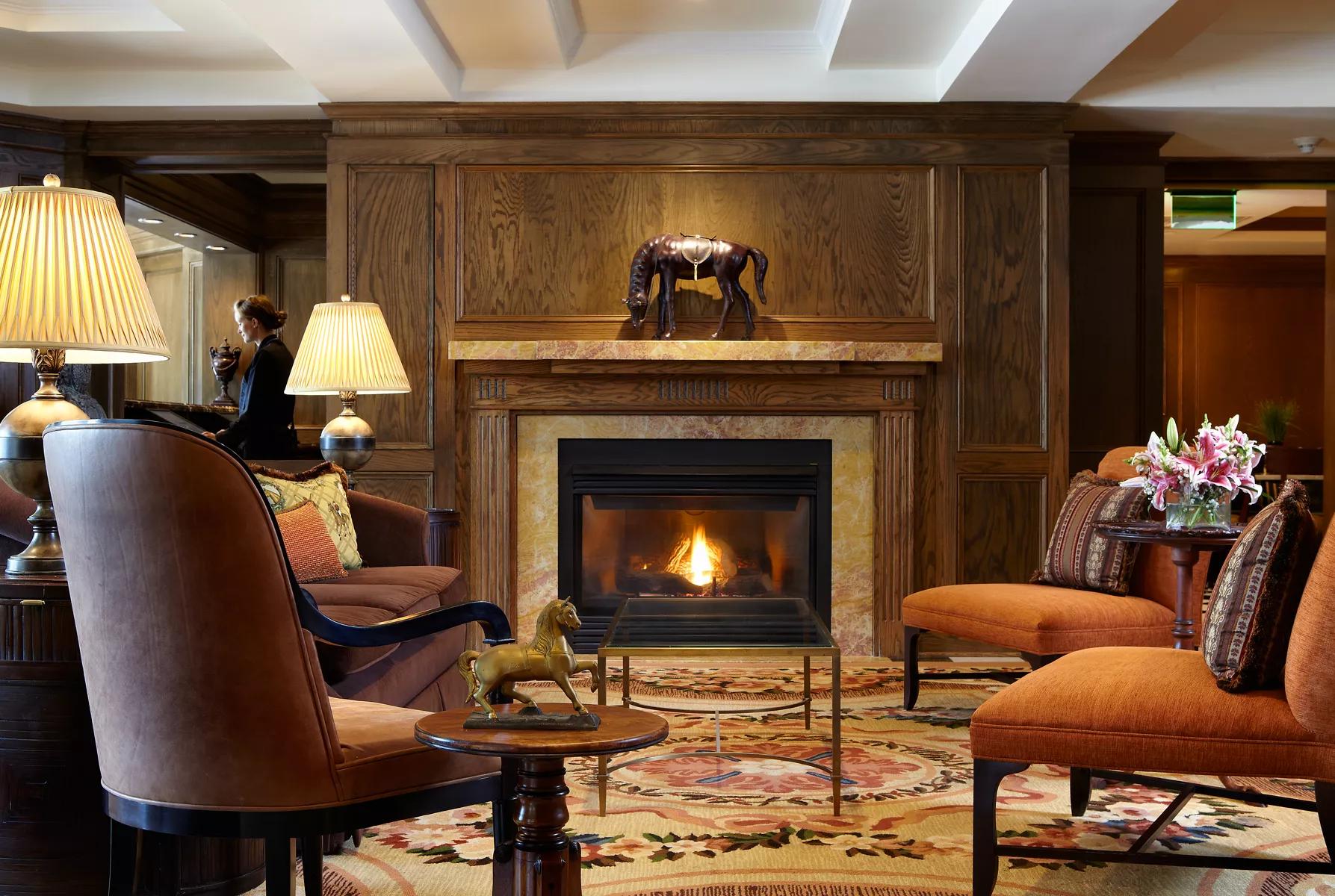 A lounging area with seating and a fire pit