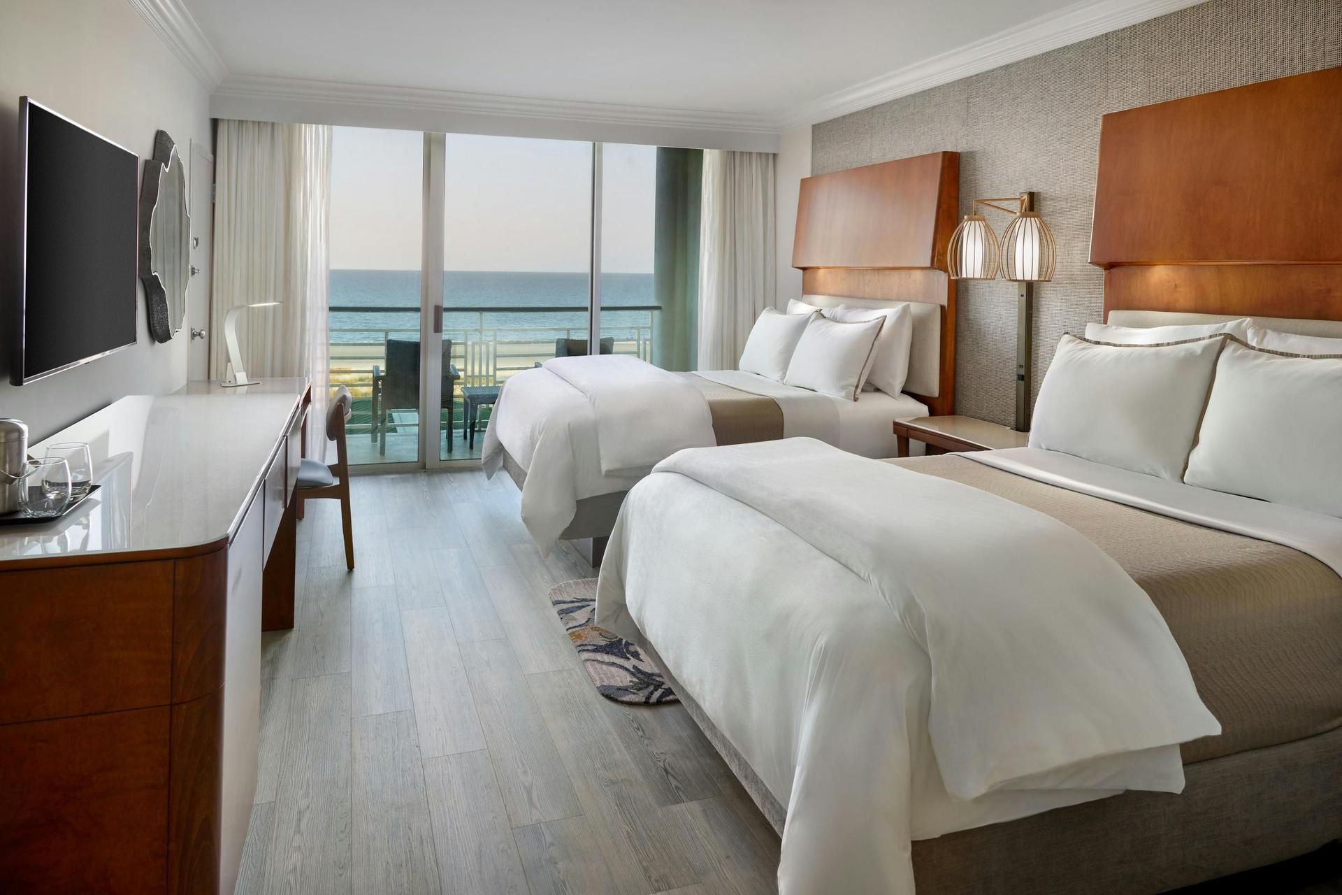 Twin double bed room with balcony views