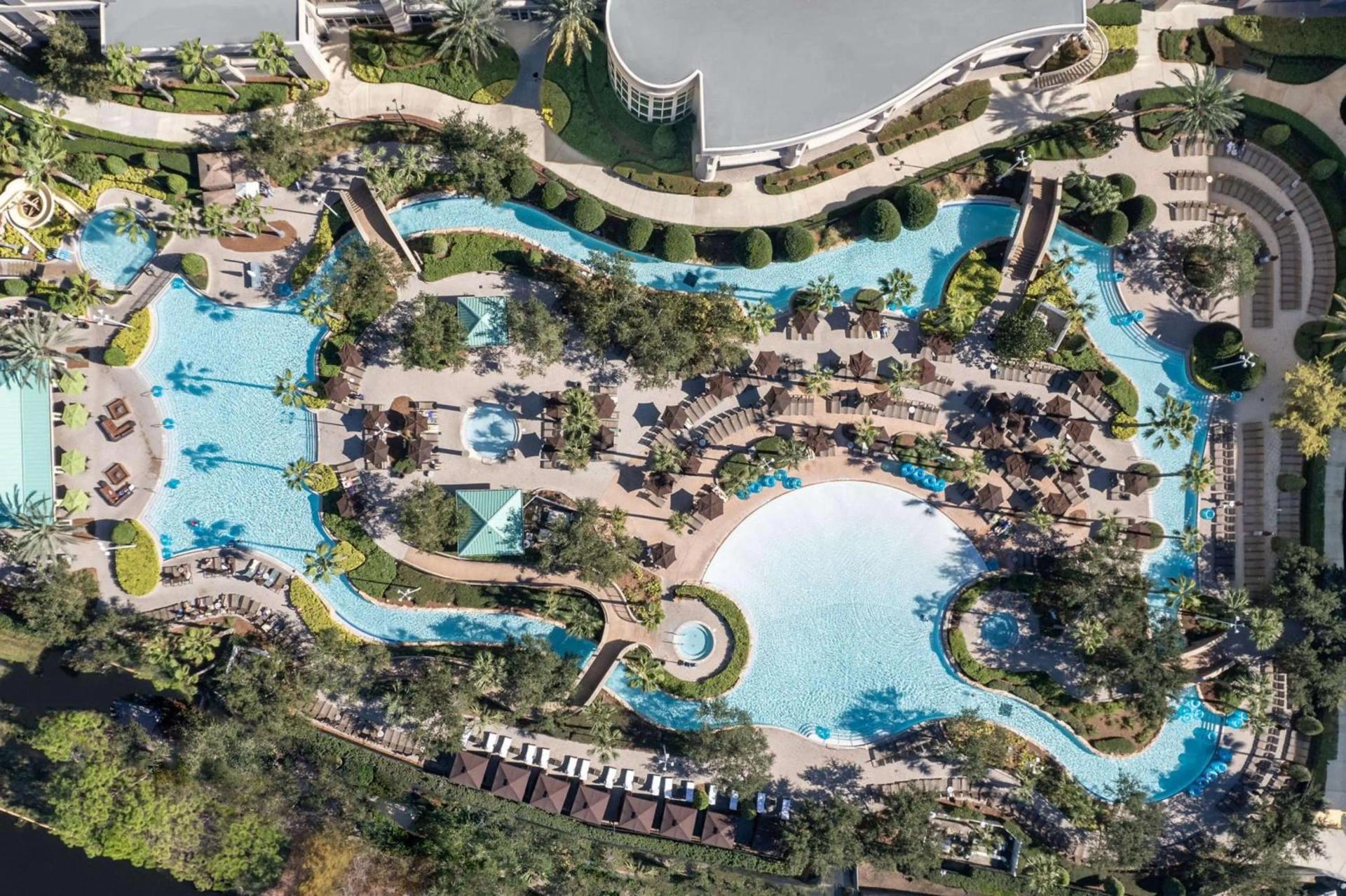 Birdseye view of the outdoor swimming pool with a lazy river design