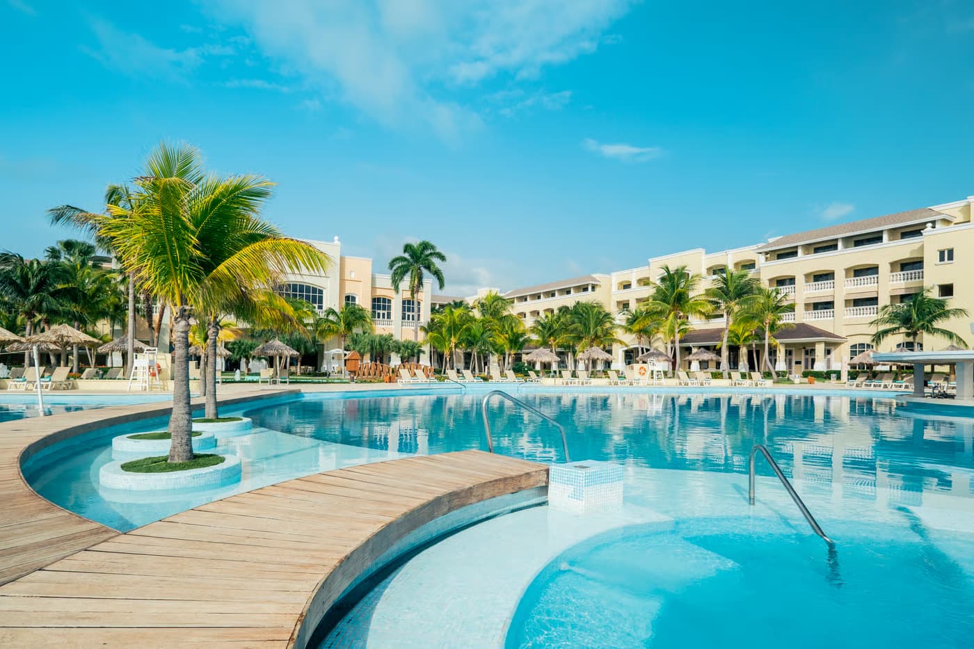 Panoramic view of the Iberostar Waves Rose Hall Beach building overlooking the outdoor pool