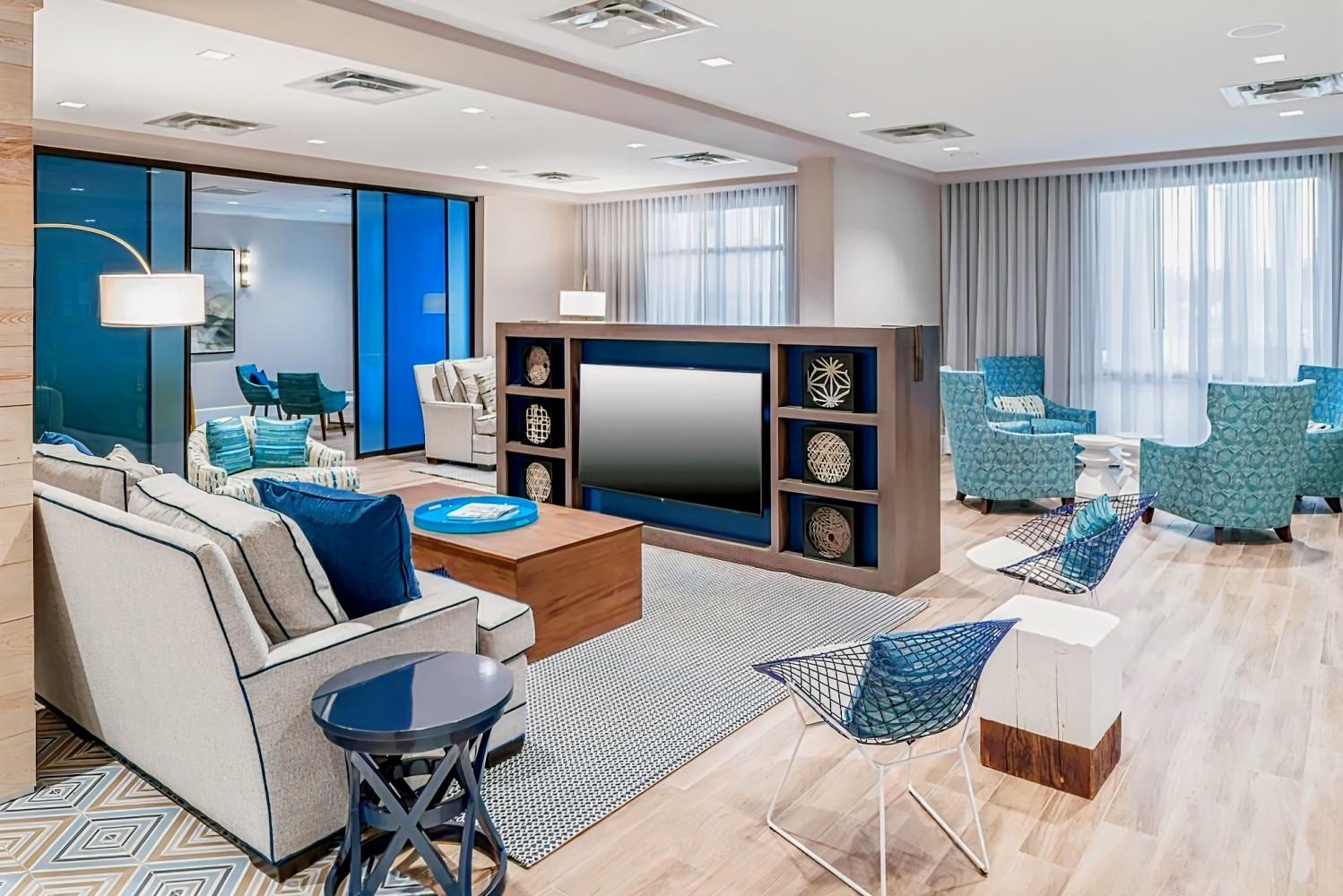 Spacious Reception area at the hotel equipped with a smart TV and many seating options