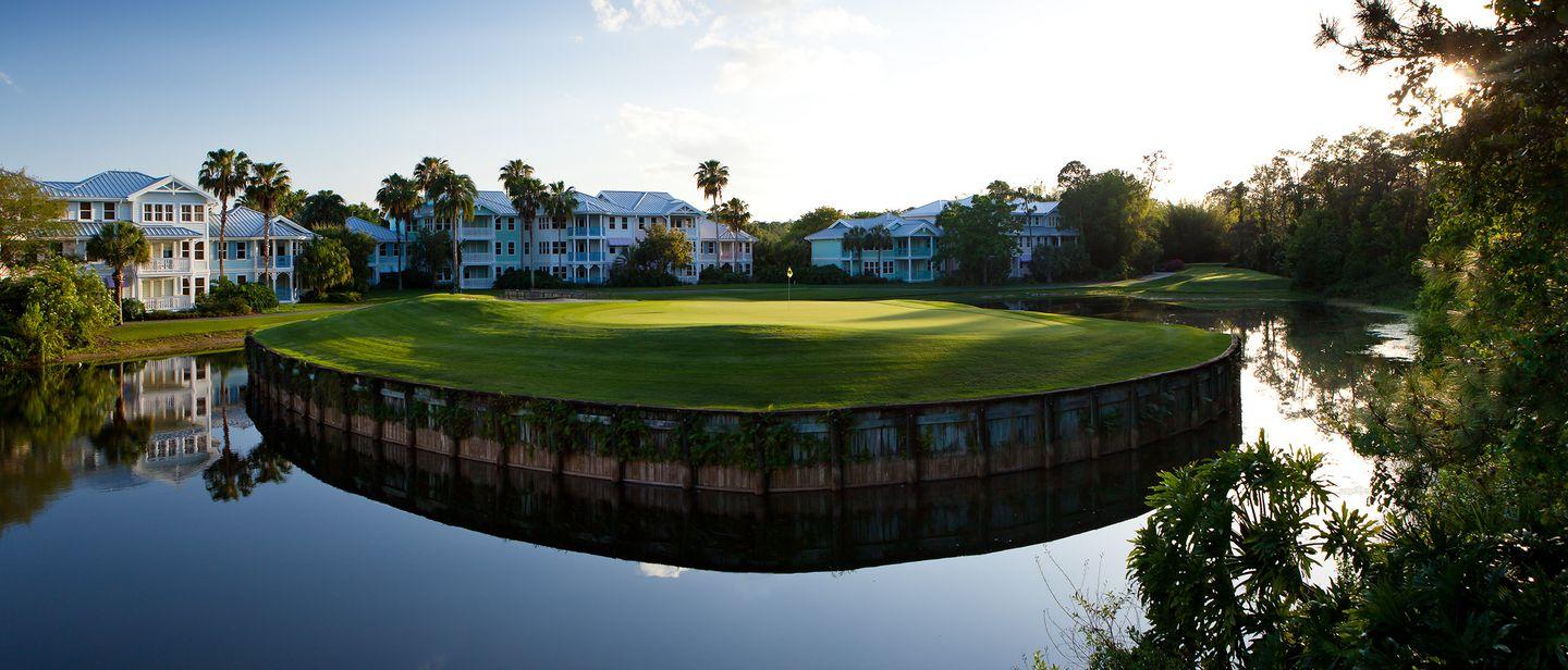 A green placed on an island surrounded by water hazard just outside the clubhouse