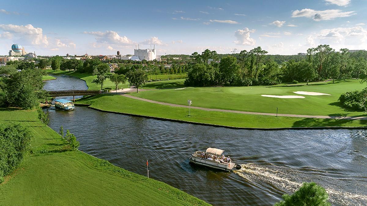 Overhead view of boats sailing down a river that leads through Disney's Lake Buena Vista Golf Course