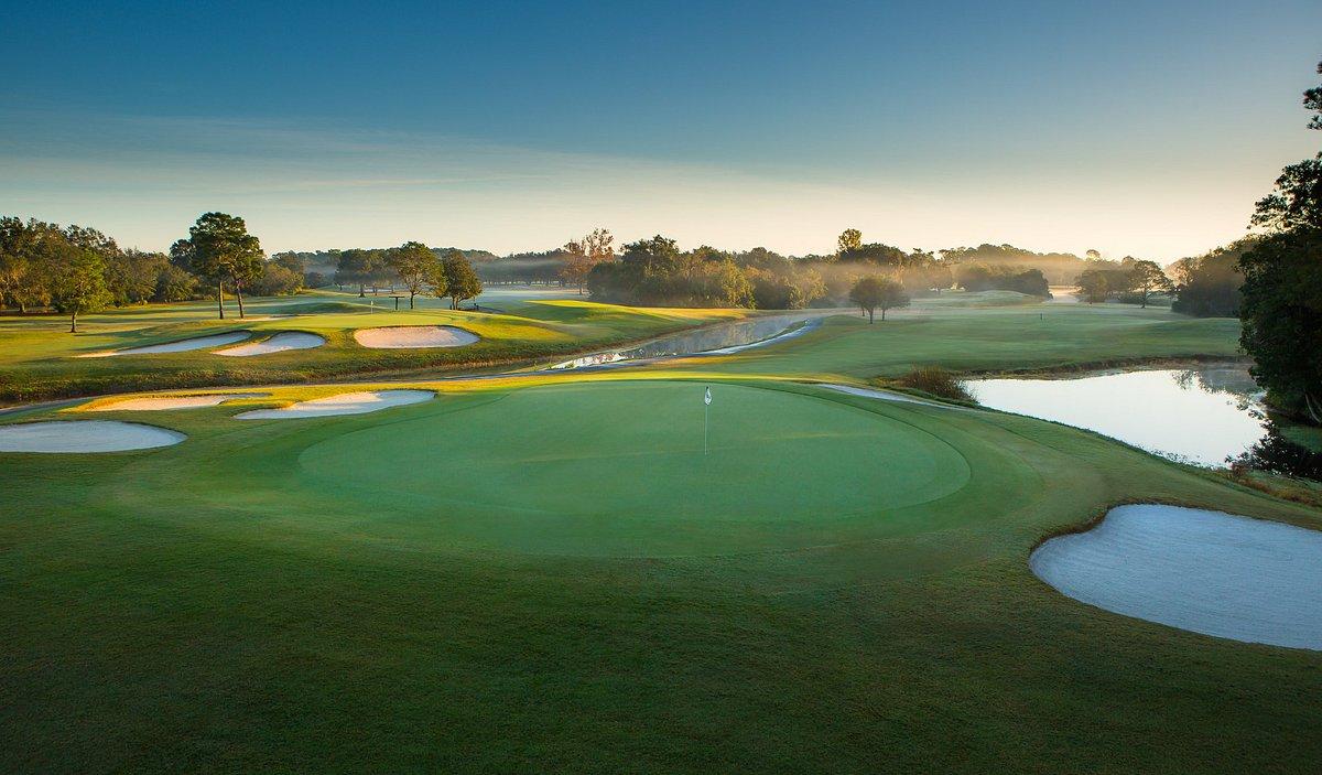 Green at Disney's Magnolia Golf Course scattered with water hazards and sand bunkers
