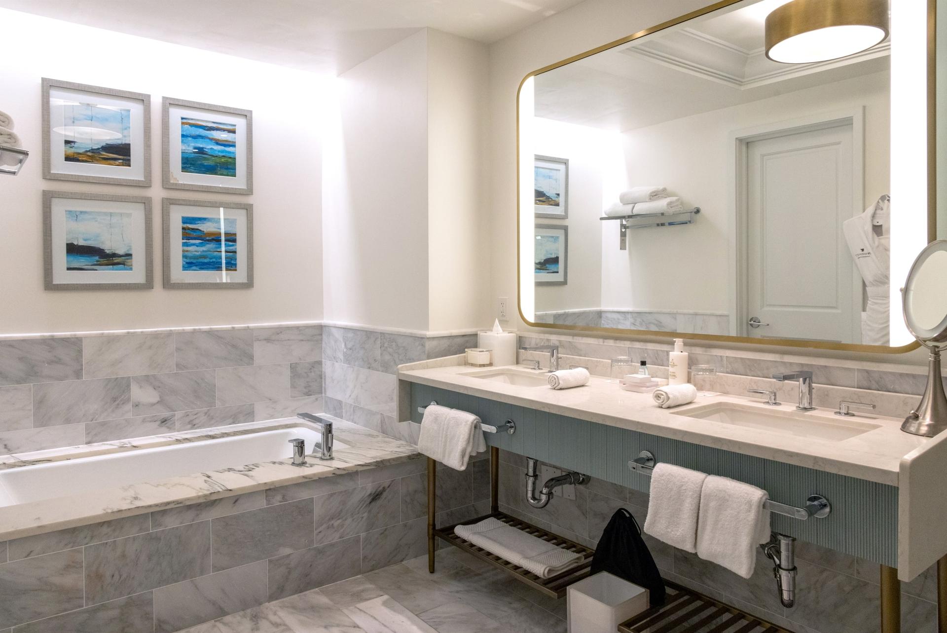 His and hers sinks in the marble bathroom at part of a hotel suite