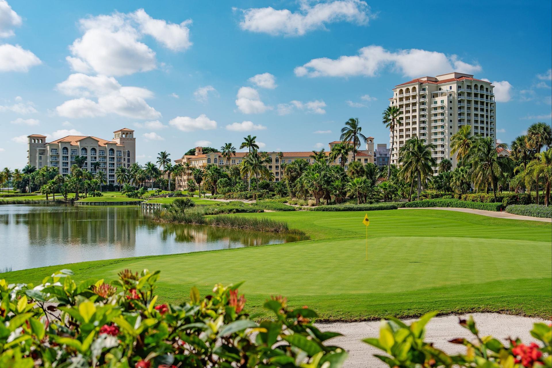 The resort building looking over balm trees and the on sight course