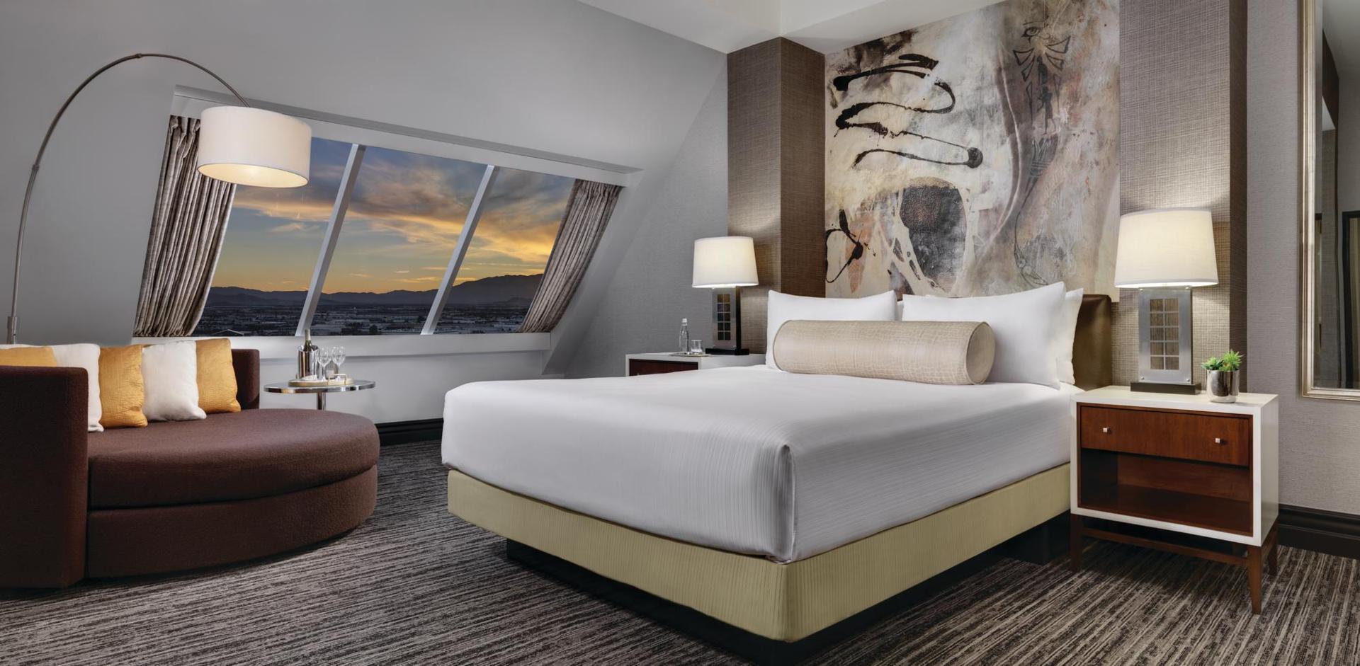 Modern double bed room at the resort with a window