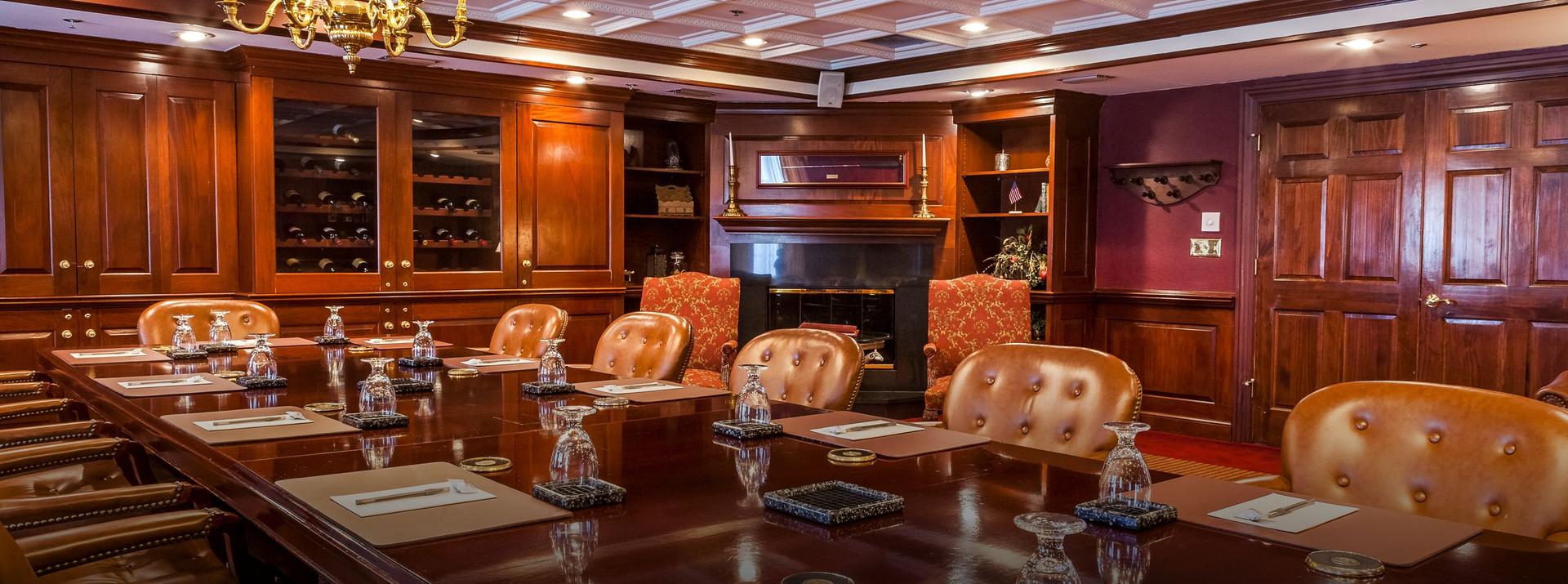Meeting room at the hotel featuring a wine cupboard following a rustic wooden design