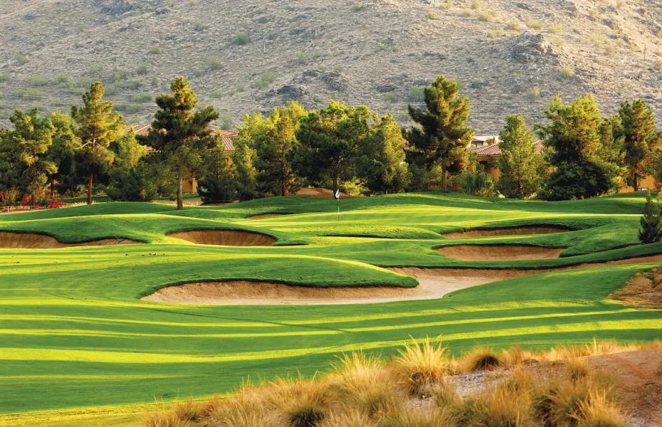 A winding fairway nestled with sand bunkers