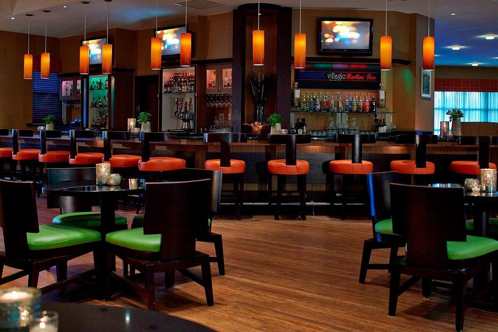 Bar at the Renaissance Resort with Tv entertainment bar stools and also dining tables