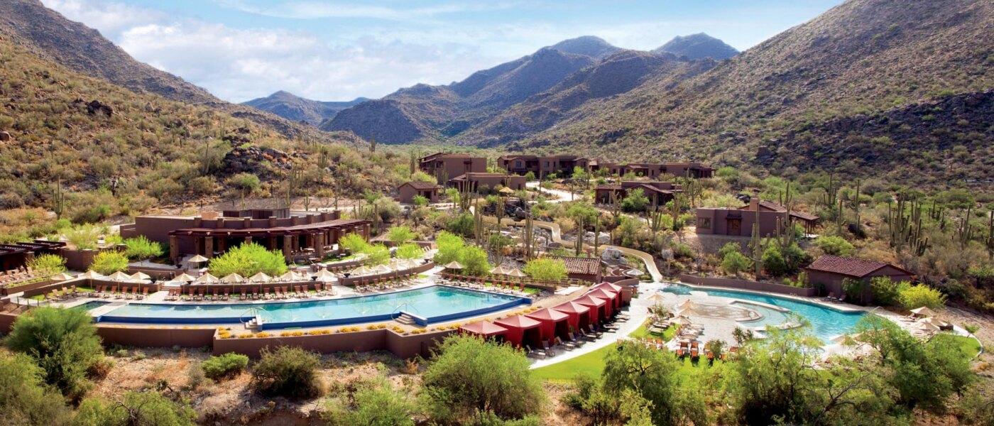 Overhead view of mountains towering over the outdoor swimming pool