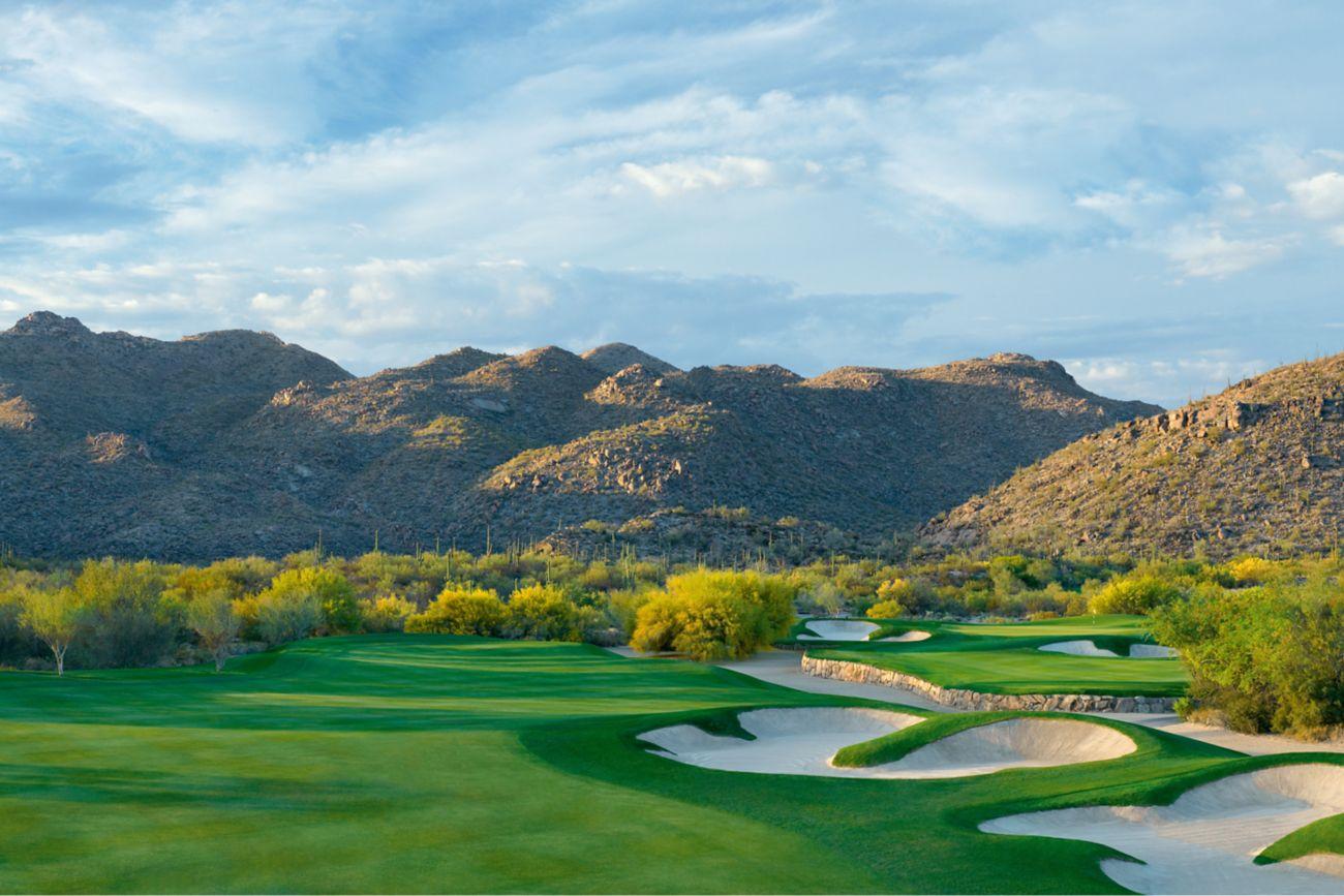 A winding fairway littered with sand bunkers
