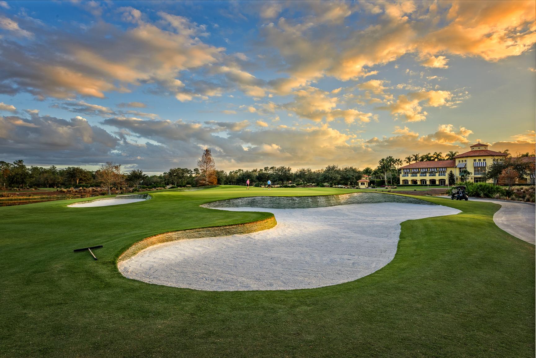 Panoramic view of the golden sun shining down on the The Ritz clubhouse and course