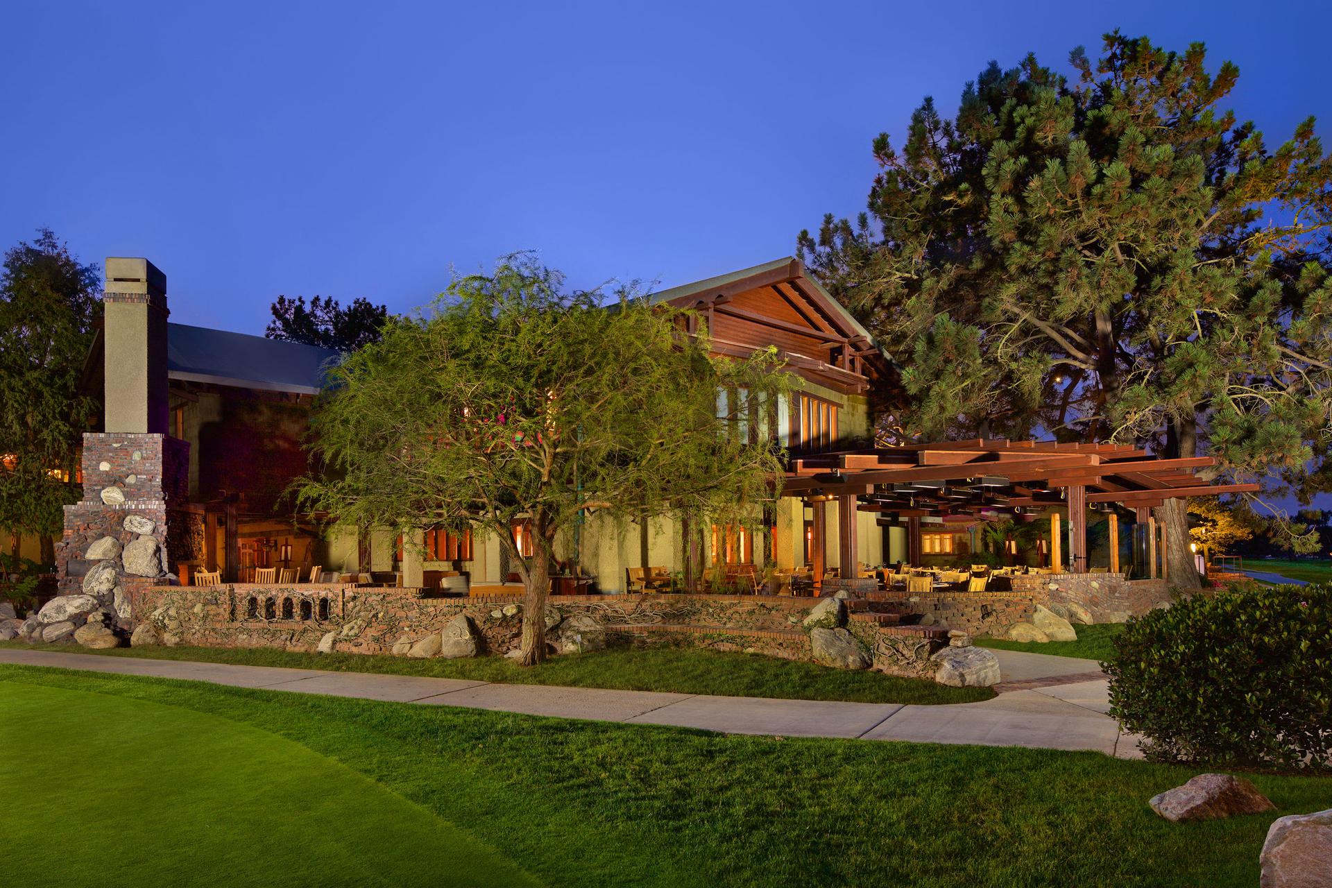 Exterior view of The Lodge at Torrey Pines clubhouse under evening sky's