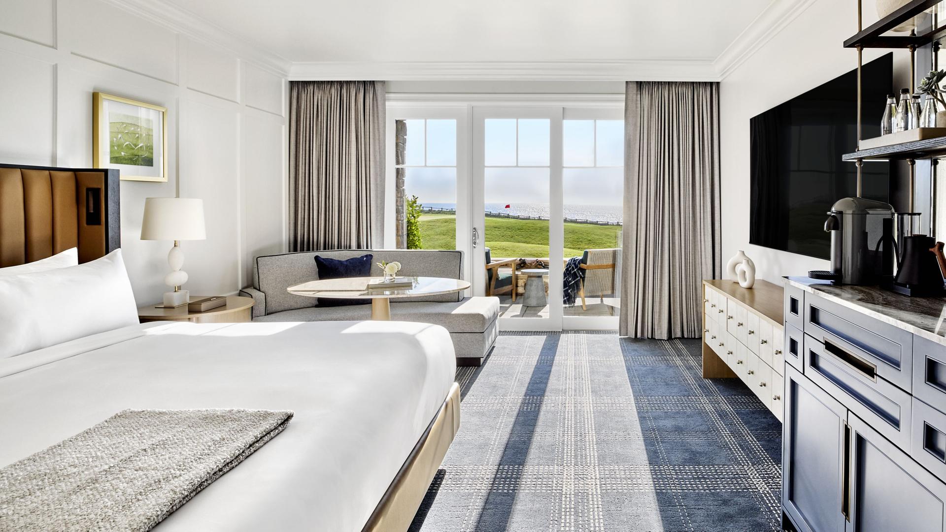 Double bed suite with a lounging area and balcony views