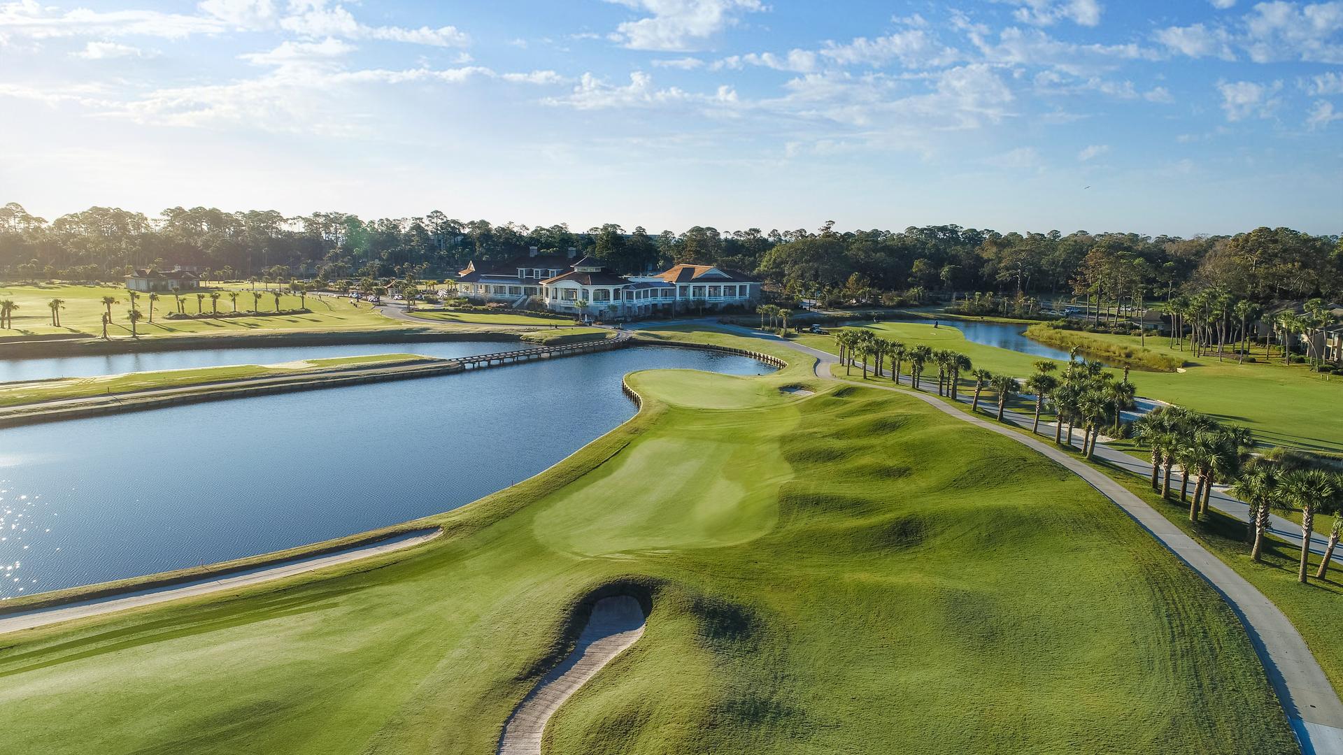 Aerial view of The Sea Pines Resort with its clubhouse looking over the course