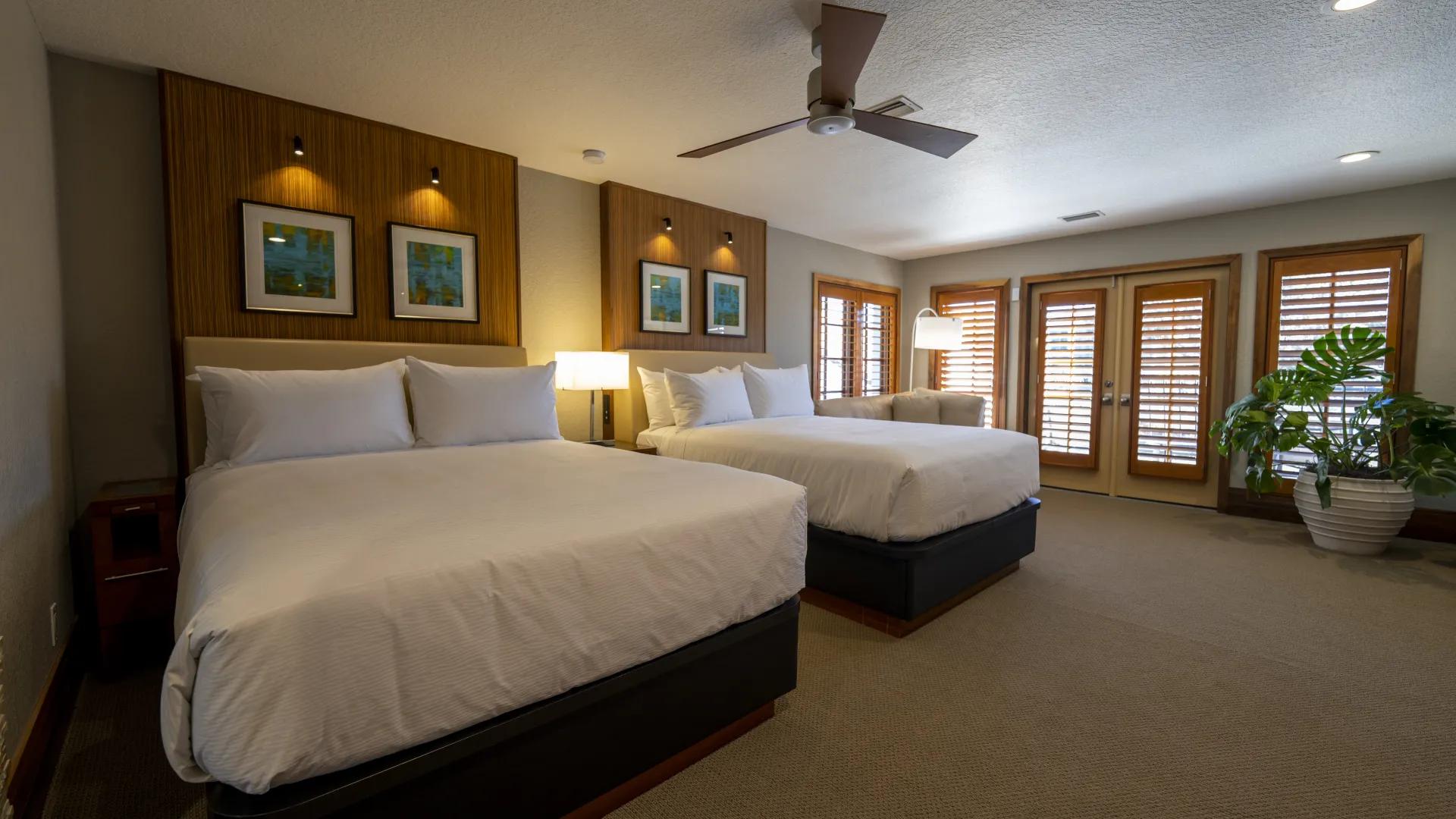 Twin room with a double and single bed at the Villas of Grand Cypress-Evermore
