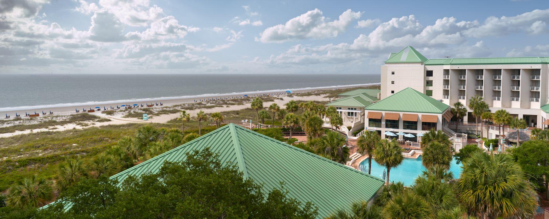 Overhead view of the resort showing its swimming pool and sea views