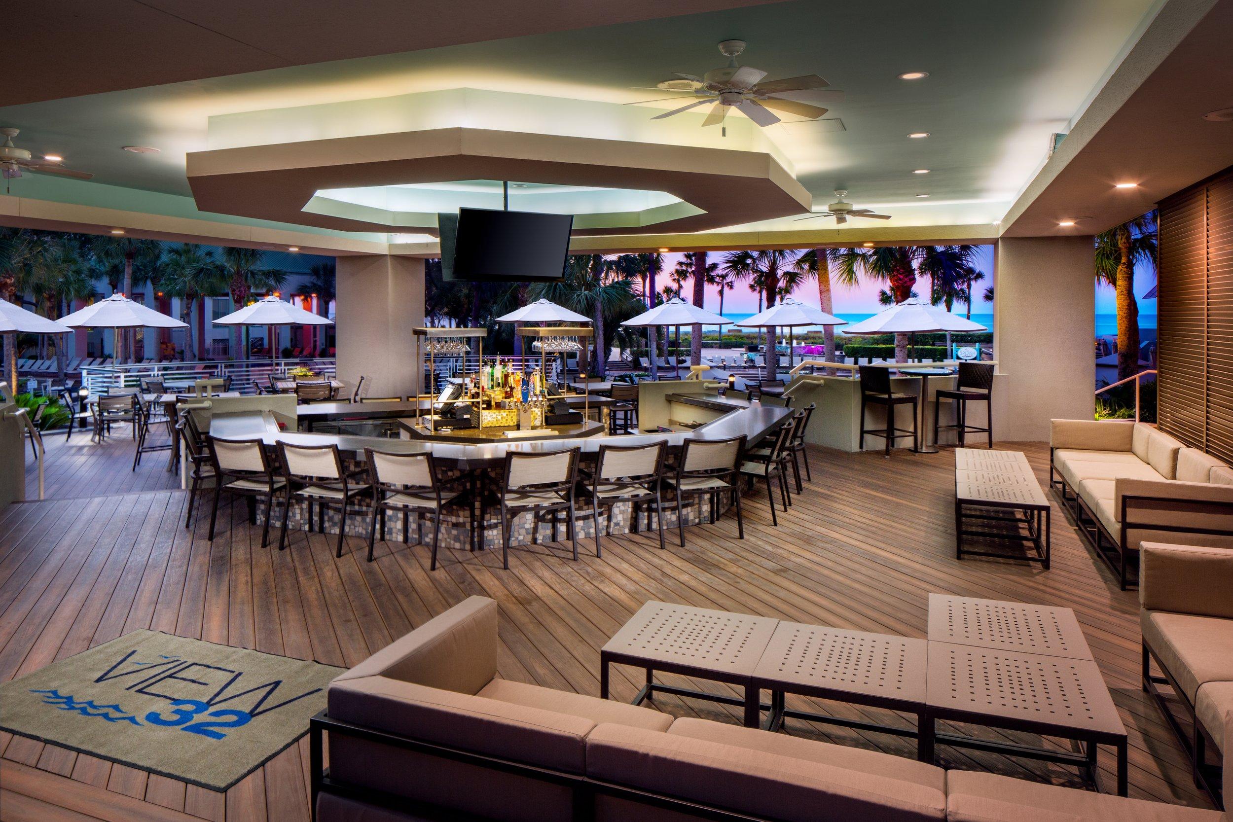 Outdoor bar with multiple seating options at the Westin Hilton Head Island Resort