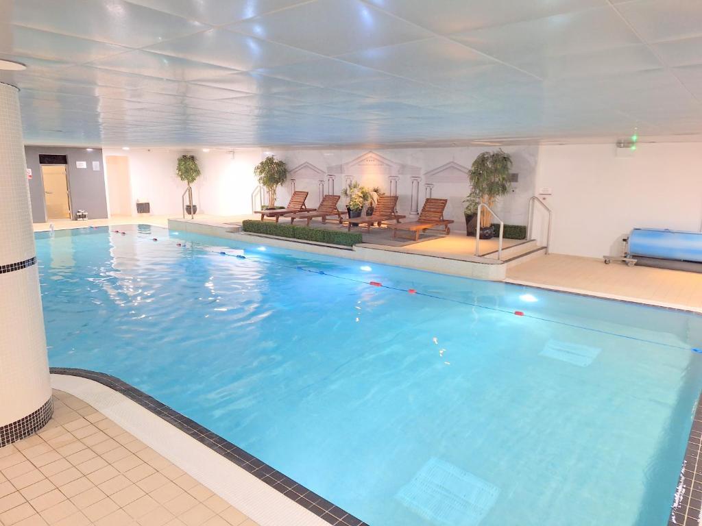 Indoor swimming pool at the lodge with a sunbed area to kick back and an established lane for laps