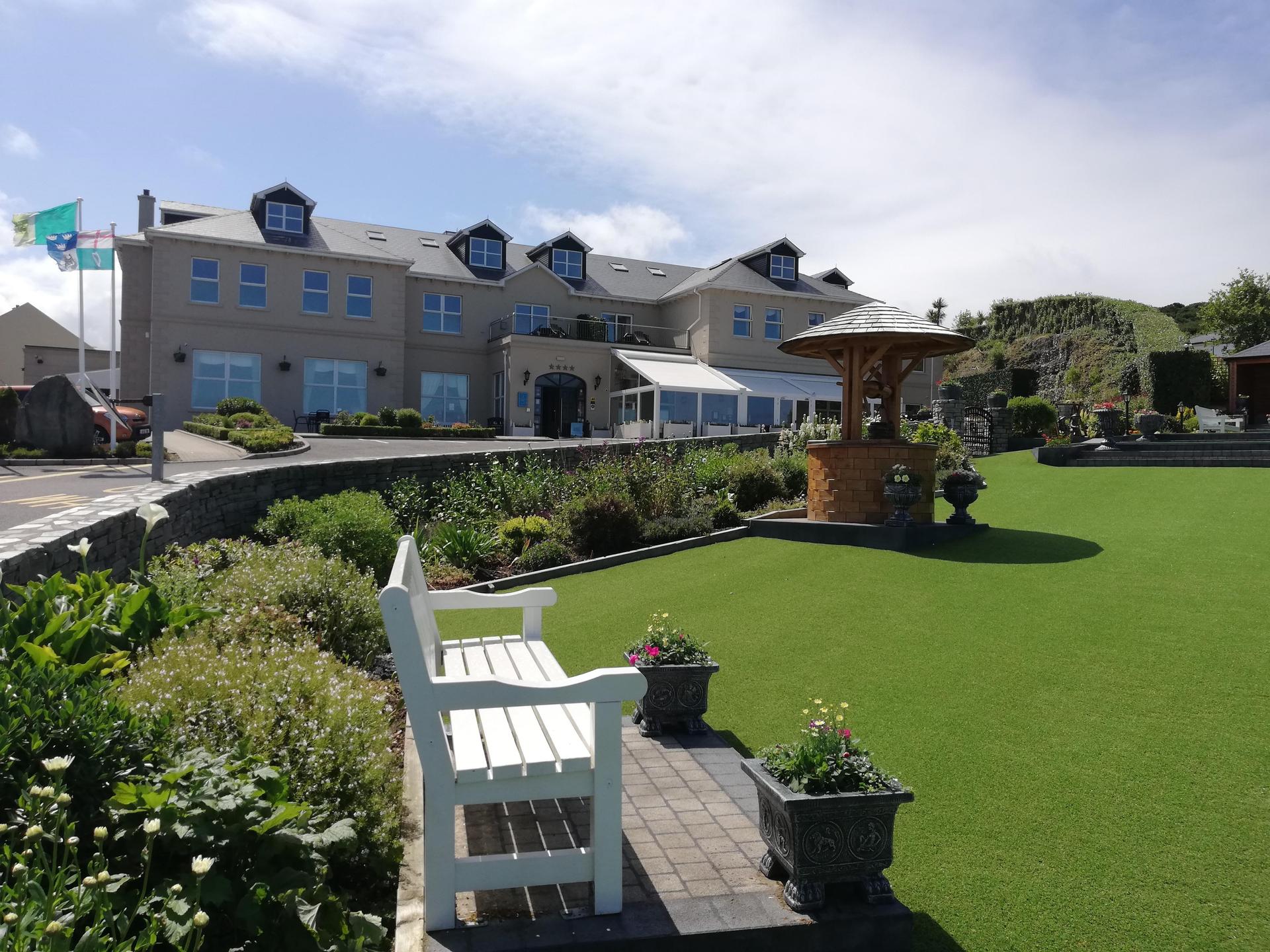 The Ballylifin Lodge looking over the greens that features a wishing well